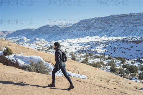 Caucasian woman hiking on remote hillside