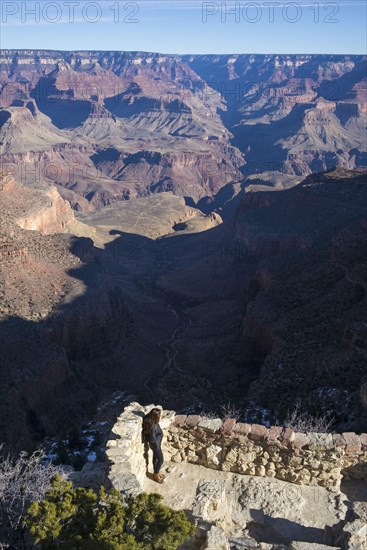 Caucasian woman admiring Grand Canyon
