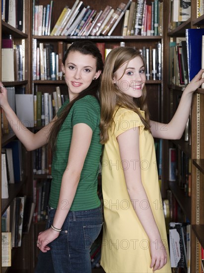 Students choosing books in library