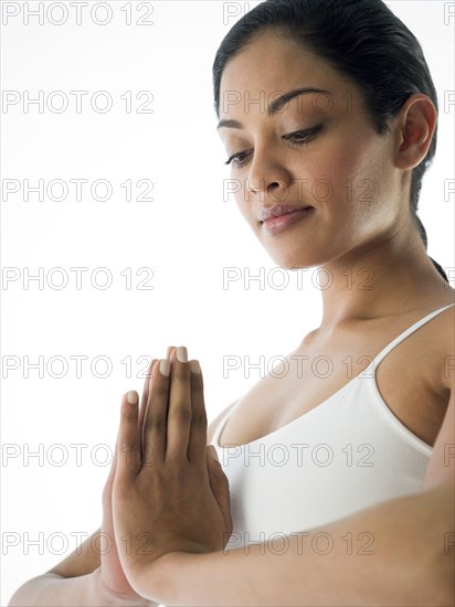Close up of serene woman meditating