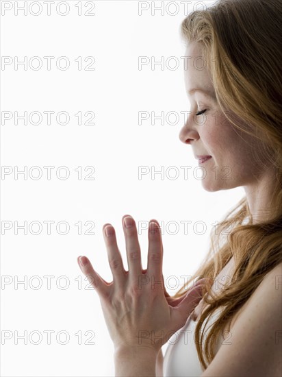 Close up of Caucasian woman meditating