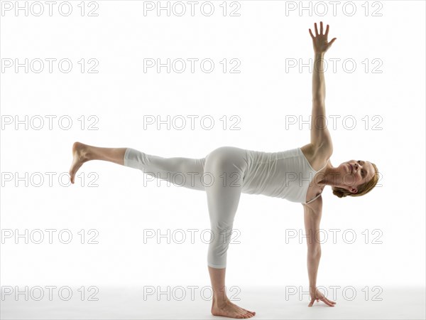 Caucasian woman practicing yoga