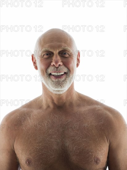 Close up of nude older man smiling