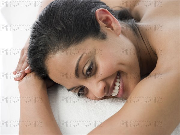 Smiling woman laying on massage table