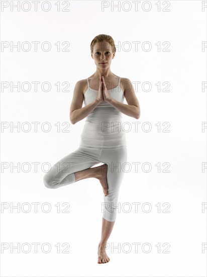 Caucasian woman practicing yoga