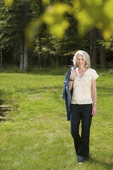 Older woman smiling in park