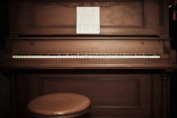 Empty piano with sheet music