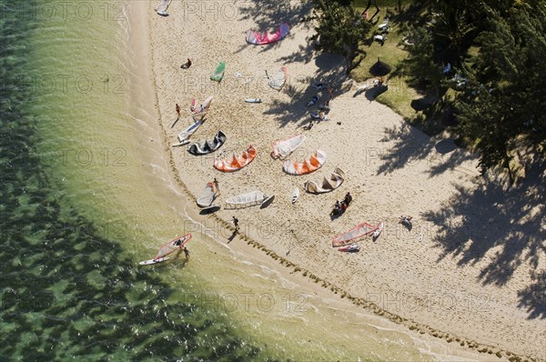 Aerial view of kitesurfers on beach