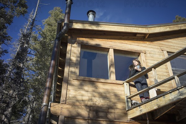 Caucasian woman standing on cabin deck