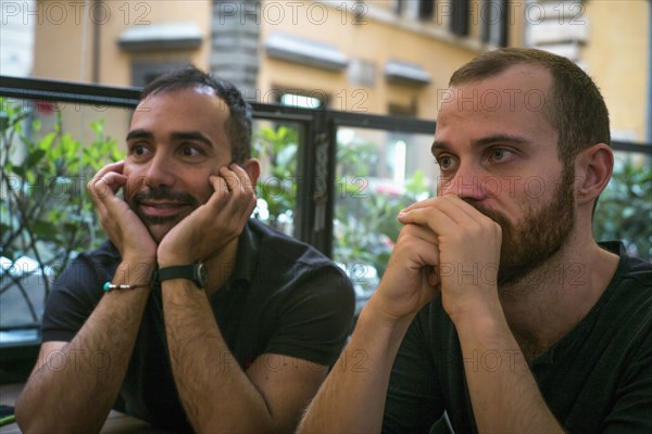 Caucasian men sitting in cafe