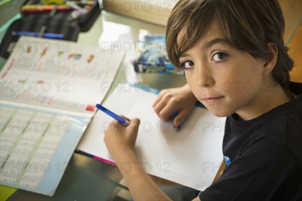 Caucasian boy doing homework