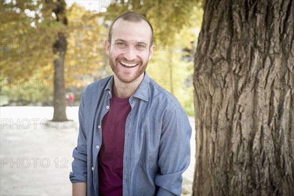 Caucasian man smiling in park