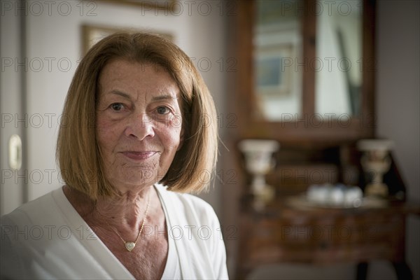Older Caucasian woman smiling indoors