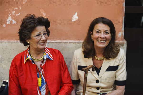 Caucasian women sitting outdoors