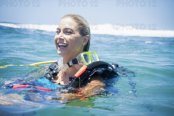 Caucasian diver swimming in ocean