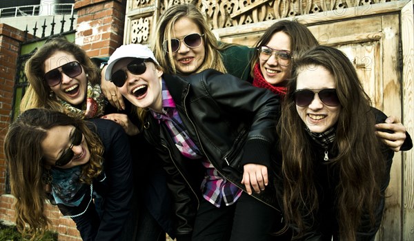 Women laughing together on city street