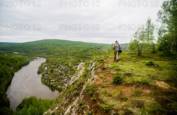 Caucasian man hiking in remote landscape