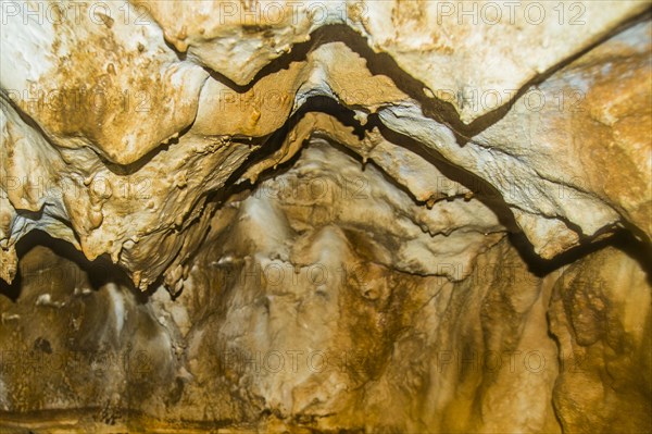 Stalactites on cave ceiling