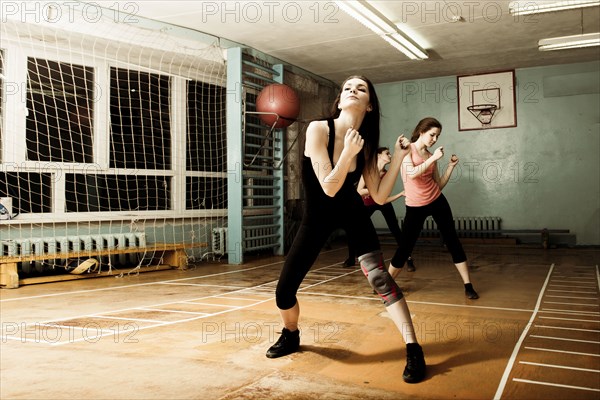 Caucasian dancers rehearsing in gym