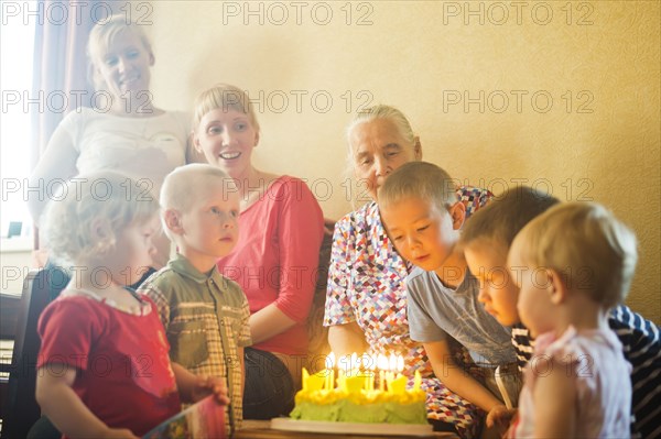 Caucasian multi-generation family celebrating birthday