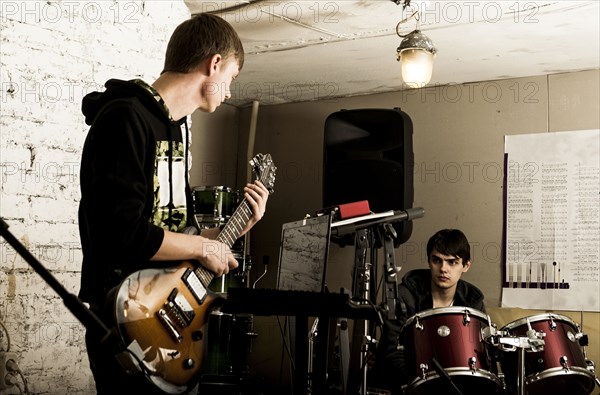 Caucasian musicians playing in rock band