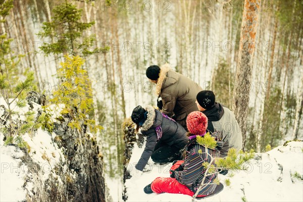 High angle view of Caucasian hikers at the edge of cliff