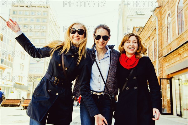 Caucasian women walking in city