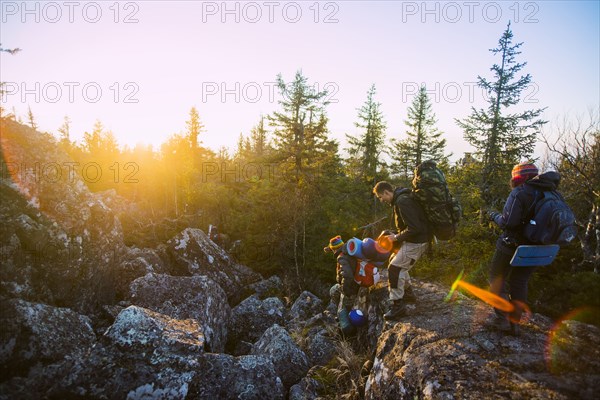 Caucasian hikers walking on remote mountainsides