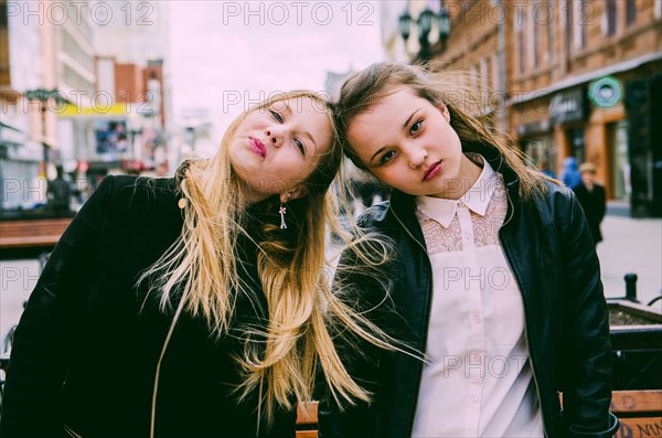 Girls standing together in city