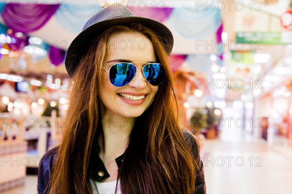 Caucasian woman smiling in shopping mall