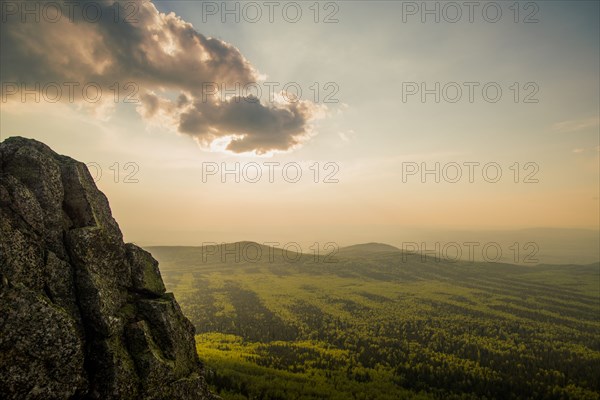 Rocky hilltop over rural landscape