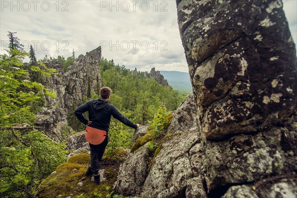 Caucasian hiker admiring view from hilltop