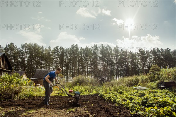 Caucasian man working in garden