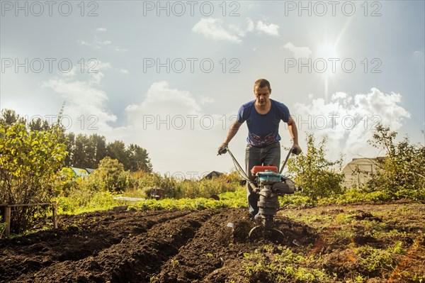 Caucasian man working in garden