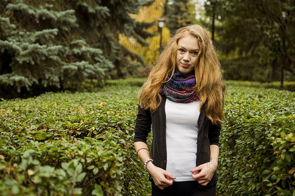 Caucasian woman standing in garden