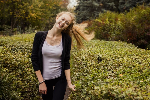 Caucasian woman standing in garden