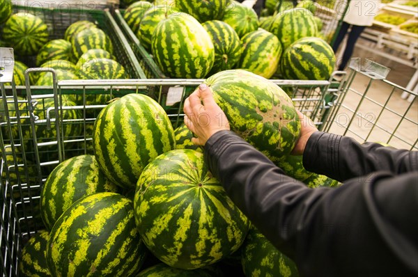 Caucasian woman shopping in grocery store