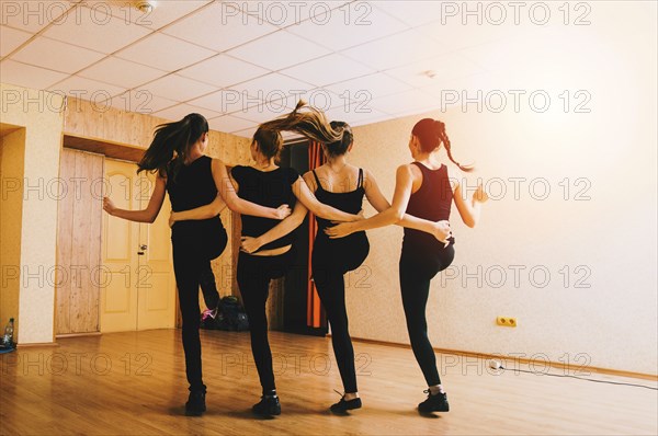 Caucasian dancers practicing in studio