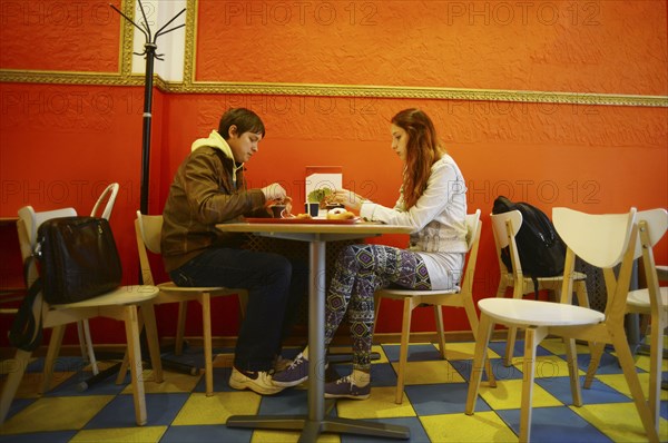 Caucasian couple eating in restaurant