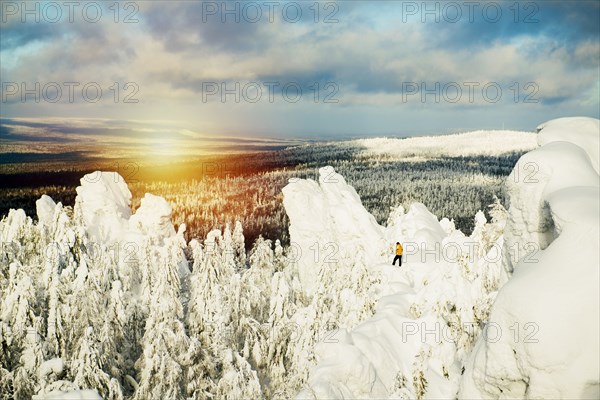 Hiker walking on snowy mountain
