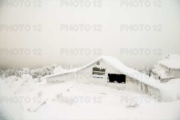 Weather station on snowy remote mountain