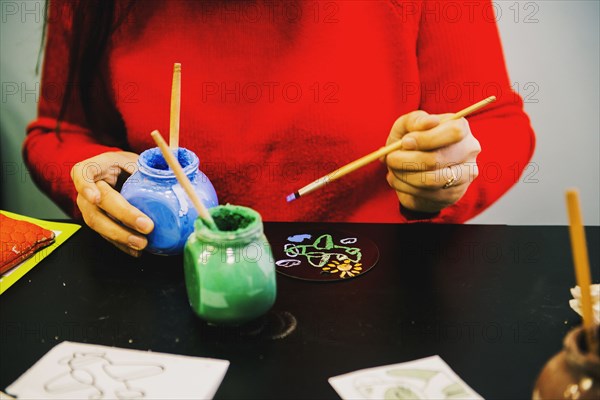 Close up of artist making miniature painting