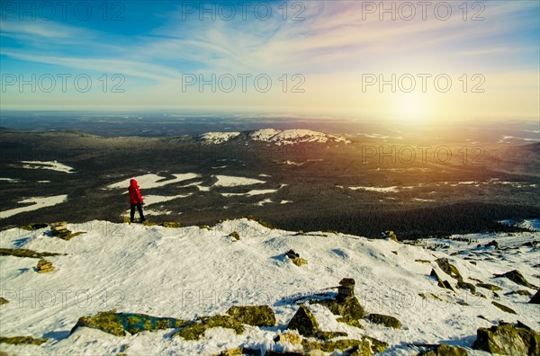 Man hiking on mountain in winter