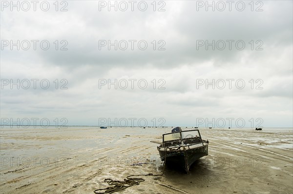 Boat on beach at low tide