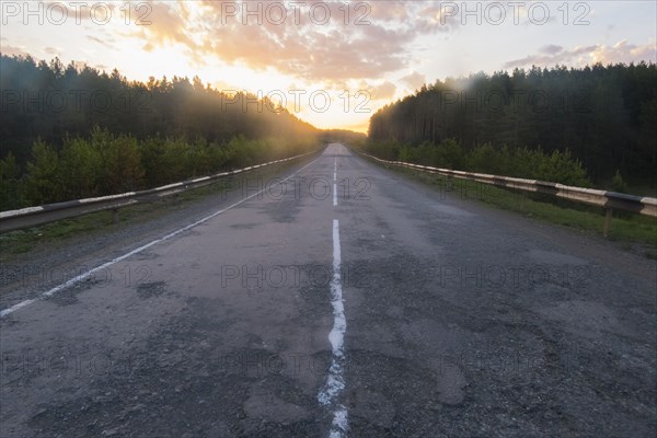 Sunset over empty freeway