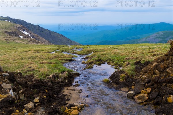 Creek flowing in mountains