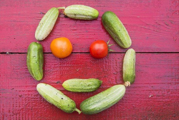 Cucumbers and tomatoes arranged in smiley face