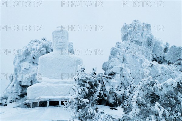 Snow on Buddha statue