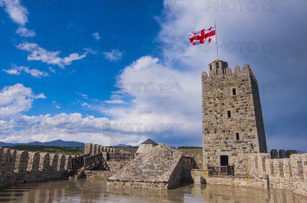 Flag blowing in wind on top of castle