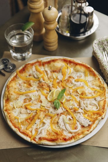 Gourmet pizza with chicken and peppers